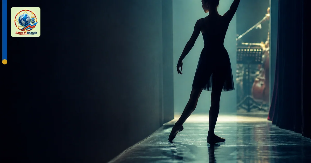 A single dancer silhouette stands in a backstage corridor with soft bluish-green lighting; the framed backstage opening revea