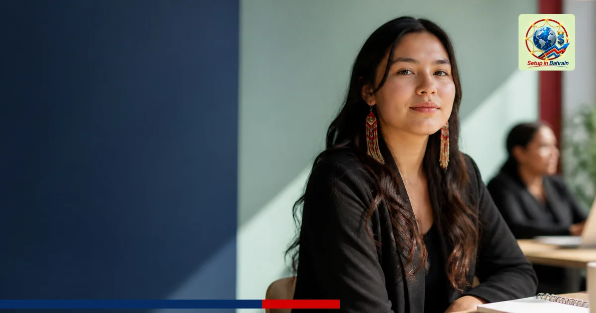 A clean, editorial-style scene showing a single Indigenous youth leader in a modern workspace with a pale green-to-blue backd