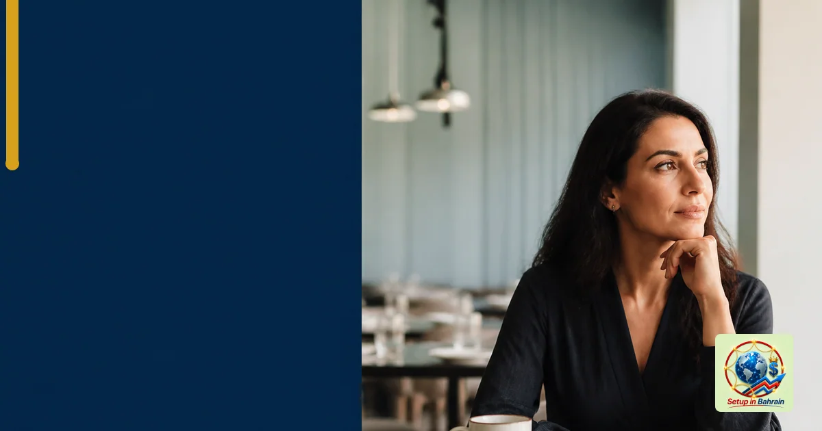 A single person in a quiet, modern restaurant interior sits with a notebook and a coffee mug, looking reflective. The left si