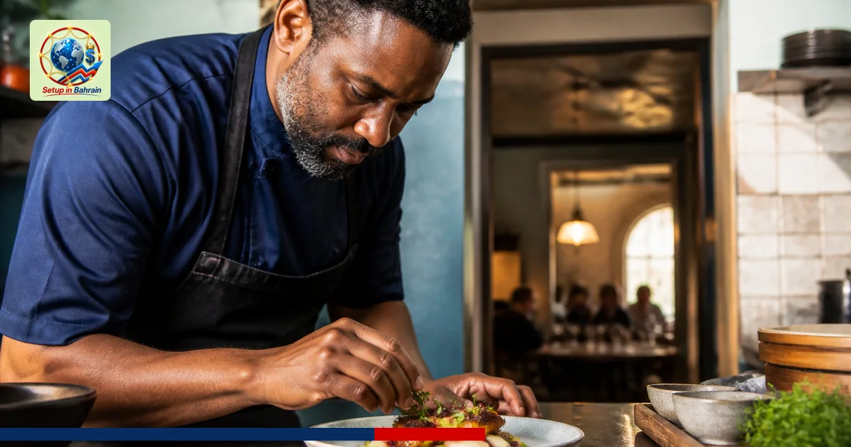A single Milwaukee Southside restaurant chef plates a signature dish in a warm kitchen, with a doorway showing a hint of a di